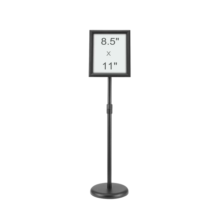 A floor-standing sign holder on a weighted base, its frame marked 8.5 by 11 inches
